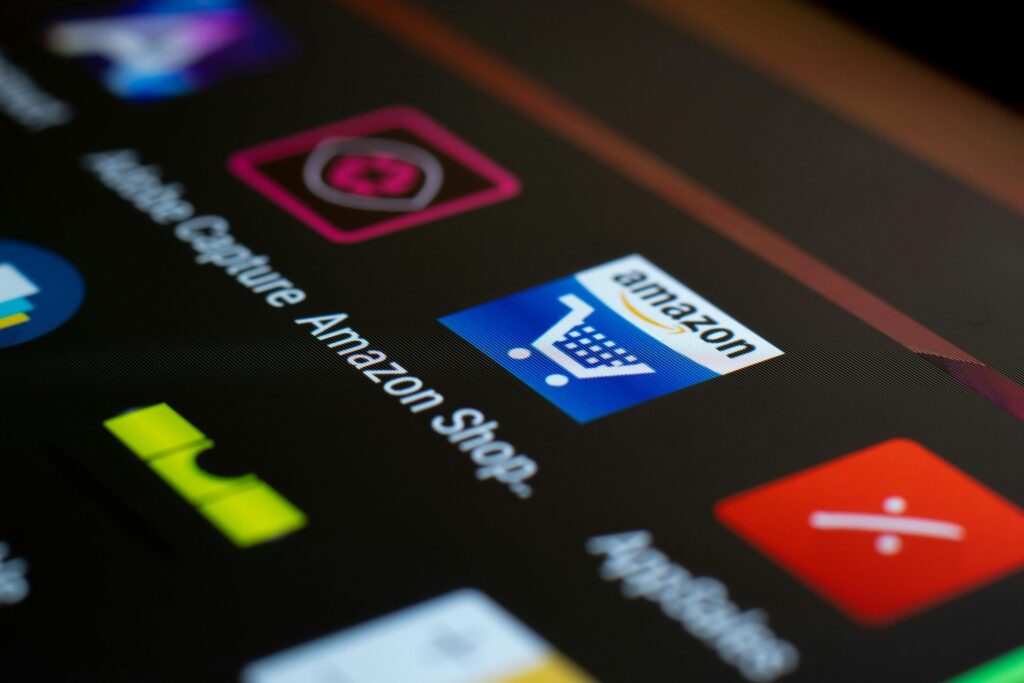 Amazon app icon on a smartphone screen, representing CRM marketing automation in B2B and B2C businesses.